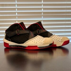 Black and Red High-Top athletic Jordan’s size 13.5